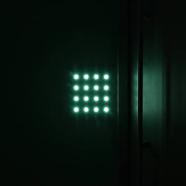 A glowing keypad representing the secure PIN that unlocks a Swing Spot bay for the reserved hour.