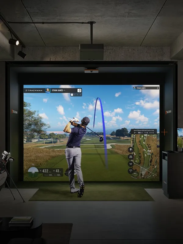 Premium TrackMan coaching atmosphere inside a private Swing Spot bay.