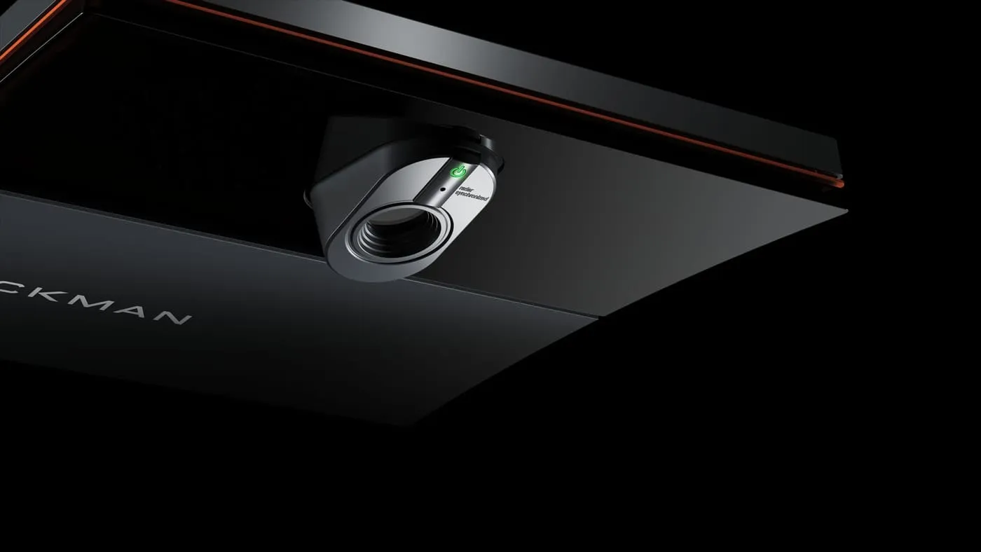 Close-up of the commercial TrackMan launch monitor mounted above the hitting bay.