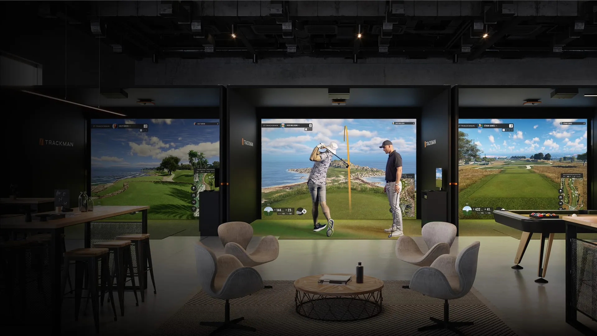 The Swing Spot lounge and simulator bay — soft seating, a bar, and a wall-sized TrackMan screen.